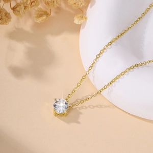 Elegant gold-plated clavicle necklace featuring a sparkling round zircon waterdrop pendant