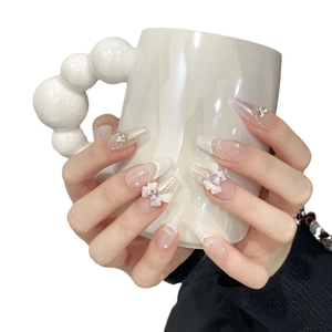 Handmade coffin-shaped press-on nails with 3D bows, rhinestones and aurora pink finish