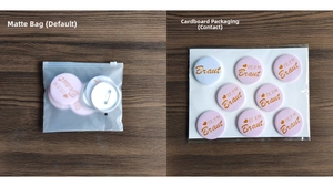 Detail view of German Bride and Team Bride pin badges in matte and blister packaging