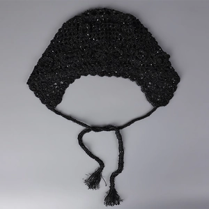Close-up of black handmade crochet floral bandana with sequins and fringe ties
