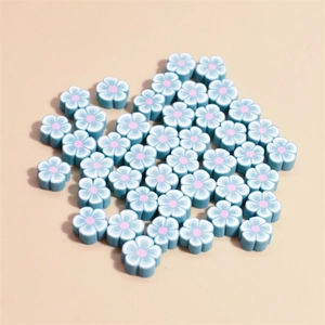 Macro shot of 10mm blue flower-shaped polymer clay beads for DIY jewelry making