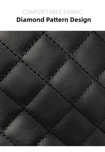 Close-up of black quilted leather texture and detailed embroidery on the shoulder bag