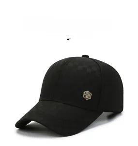 Detail of black baseball cap featuring subtle plaid texture and R2G metal side emblem