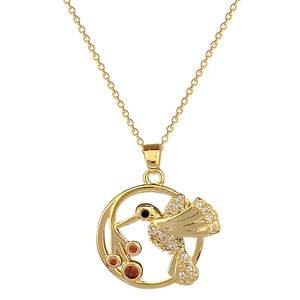 Elegant gold hummingbird pendant necklace with sparkling white zircons and red gemstones