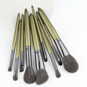 Close-up of professional olive green makeup brush set with dark soft synthetic bristles