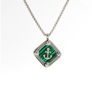 Detail of nautical anchor necklace featuring green stone inlay and silver titanium steel