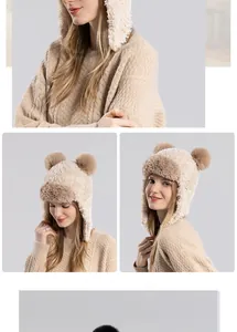 Detailed close-up of plush winter trapper hat with earflaps and fuzzy pom-poms