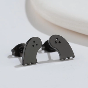 Macro shot of matte black stainless steel ghost stud earrings from side and front view