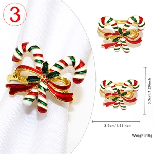Detail of candy cane napkin ring with red bow and enamel finish for Christmas decor