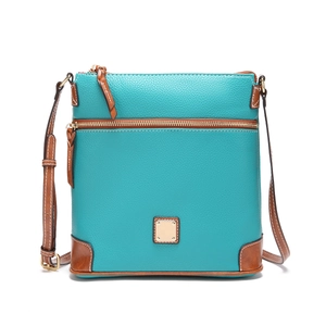 Close-up of blue lychee texture leather with brown trim and gold-tone hardware