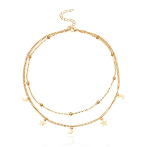 Gold double-layered anklet featuring small beads with star and moon charms on white background