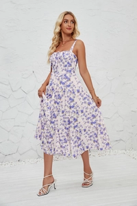 Close-up of blue floral print sundress featuring slim straps and drawstring bust detail