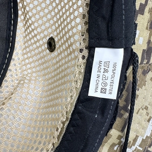 Detail of breathable mesh lining and 100% polyester wash label on camo outdoor hat