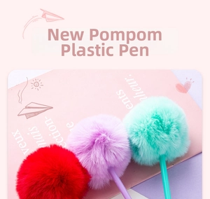 Detailed view of colorful plush pompom pens in red, purple, and mint green colors