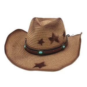 Detail of vintage straw cowboy hat featuring turquoise accents and star pattern print