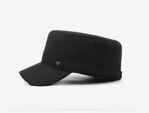 Detailed side view of a black cadet cap featuring a metallic triangle logo on textured fabric