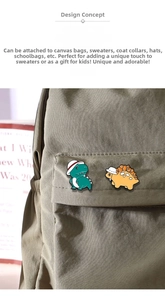 Detail of cute enamel dinosaur pins with hats, perfect for decorating backpacks and sweaters