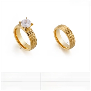 Detail view of 6mm gold hammered titanium steel rings with a single cubic zirconia stone