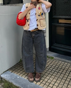 Street style view of dark grey loose fit wide-leg denim joggers with tapered ankles