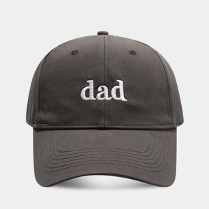 Close-up of white dad embroidery on charcoal grey cotton twill baseball cap