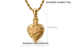 Macro detail of gold vintage heart pendant necklace with intricate engraved patterns