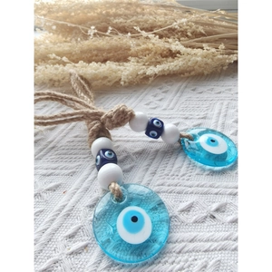 Handmade evil eye charm with blue glass pendants on twine for wall or car decor