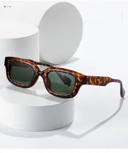 Detailed close-up of dark tortoise shell sunglasses frames and polished texture