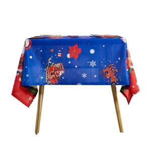 Christmas tablecloth with blue background and reindeer sleigh patterns for holiday dining decor