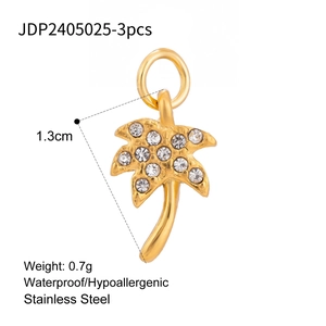 Macro view of golden stainless steel coconut tree pendant with sparkling zircon inlays
