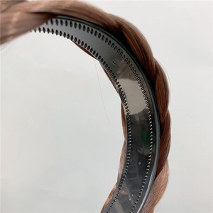 Close-up of brown fishtail braided headband with black anti-slip inner teeth