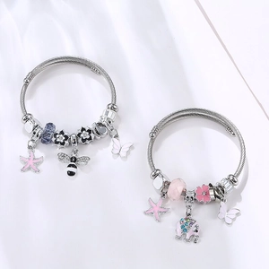 Silver steel wire bracelets with pink elephant, starfish and butterfly charms