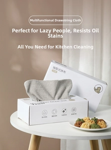 Microfiber kitchen cleaning cloths in a white dispenser box for easy counter access