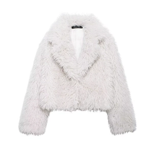 Detail of white faux fur jacket featuring a standing collar and plush long-hair texture