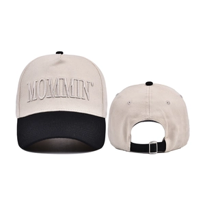Detail of MOMMIN embroidered baseball cap showing front stitching and adjustable back buckle