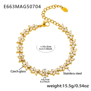 Macro view of gold stainless steel bracelet with white zircon flower links and size specs