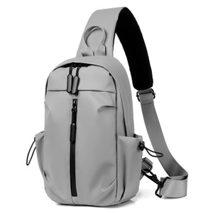 Front view of grey water-resistant nylon chest bag with vertical zipper and adjustable strap