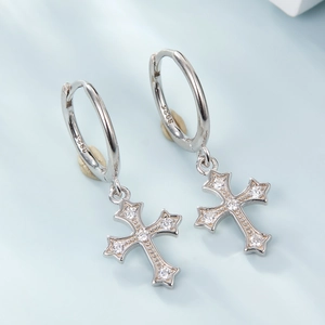 Close-up of S925 sterling silver hoop earrings with micro-pave zircon cross charms