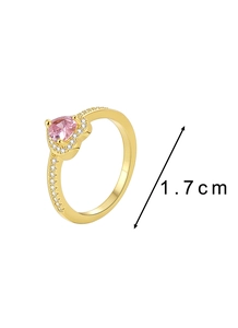 Detail shot of heart-cut pink zircon ring showing 1.7 cm inner diameter measurement