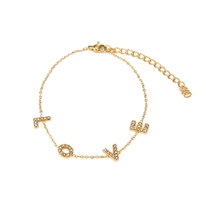 Gold plated stainless steel LOVE letter bracelet with cubic zirconia on white background