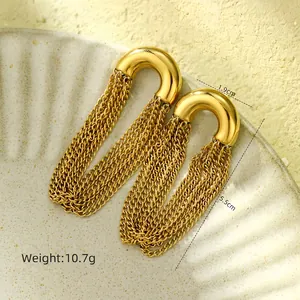 Detail of gold-plated long tassel earrings featuring a U-shaped stud and sleek chain fringe