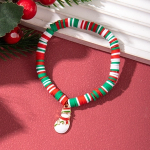 Detailed close-up of a festive polymer clay Christmas bracelet with a snowman pendant