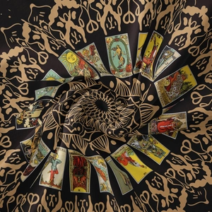 Close-up of bohemian moon phase tapestry fabric with golden tarot card patterns