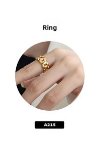Detail view of 18k gold chunky chain link ring worn on finger with a polished metal finish