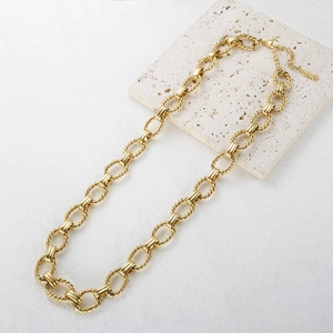 Golden chunky chain necklace with twisted oval links and LOVE engraved pendant