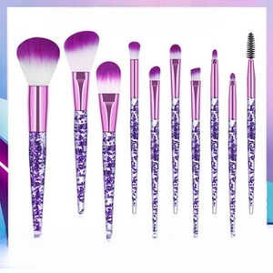 Detail of purple marble handle makeup brushes with synthetic gradient bristles and metal ferrule