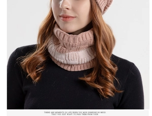 Close-up of pink and cream striped knit beanie and scarf set with thick yarn texture
