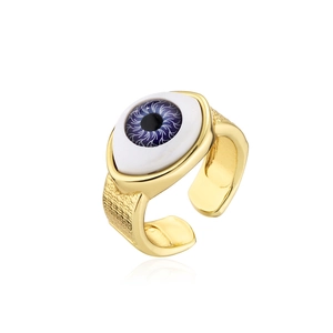 Macro detail of 18K gold plated adjustable evil eye ring with blue iris and textured band