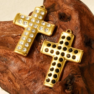 304 stainless steel cross pendant set with black and white rhinestones on wood