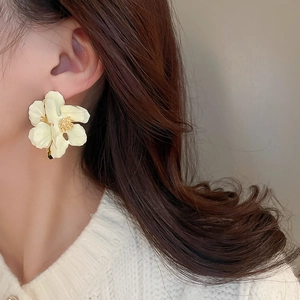 Elegant pale yellow floral stud earrings for women with layered 3D petals and golden accents