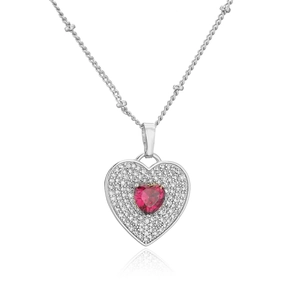 Silver necklace with zircon heart pendant and red gemstone center on white background